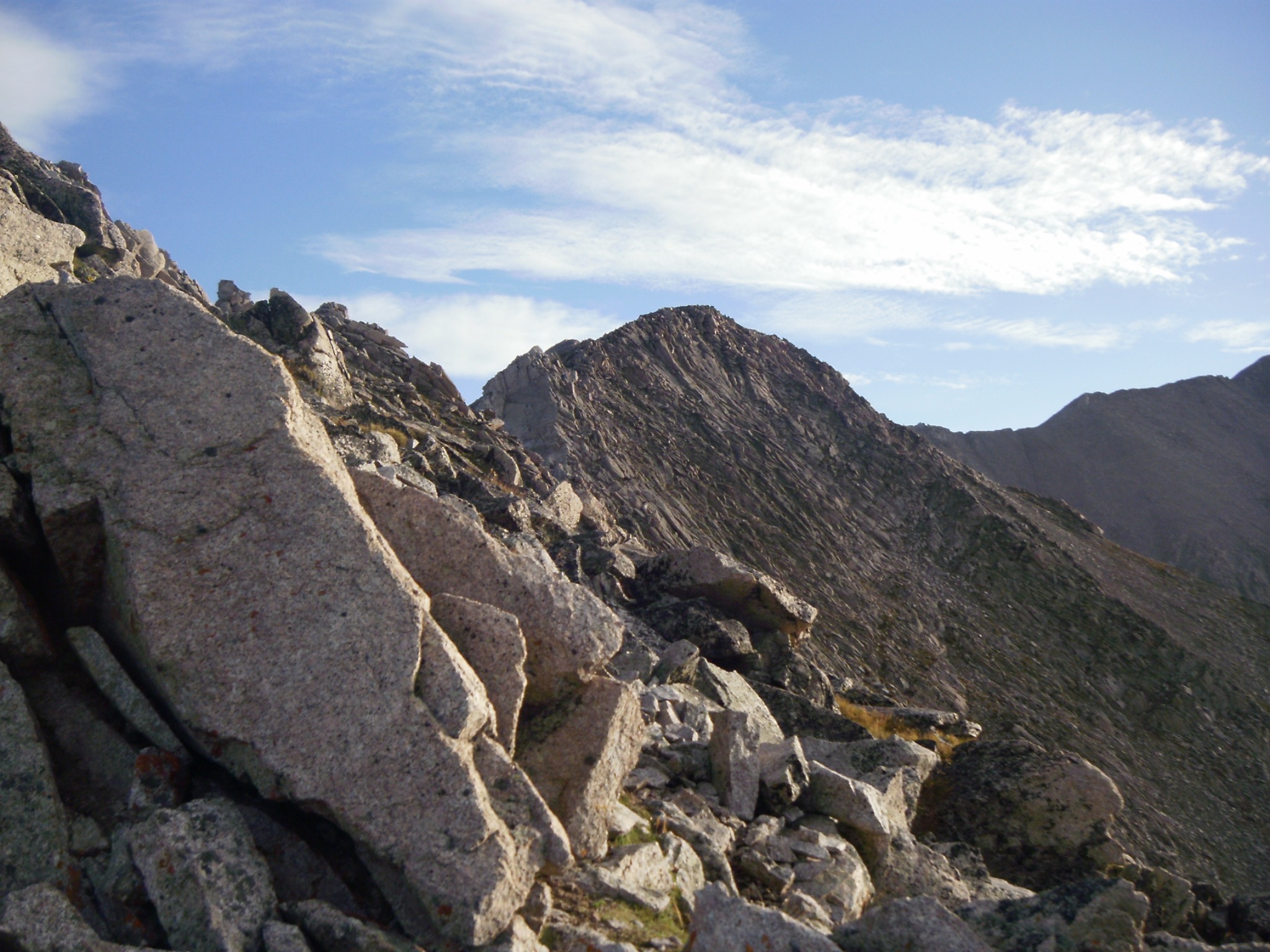 Rocky scree slope on Mount Princeton with granite boulders in early morning light